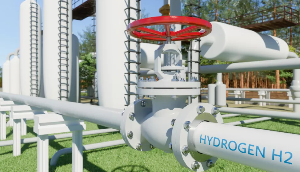 A close up of a pipe labeled hydrogen at a hydrogen plant